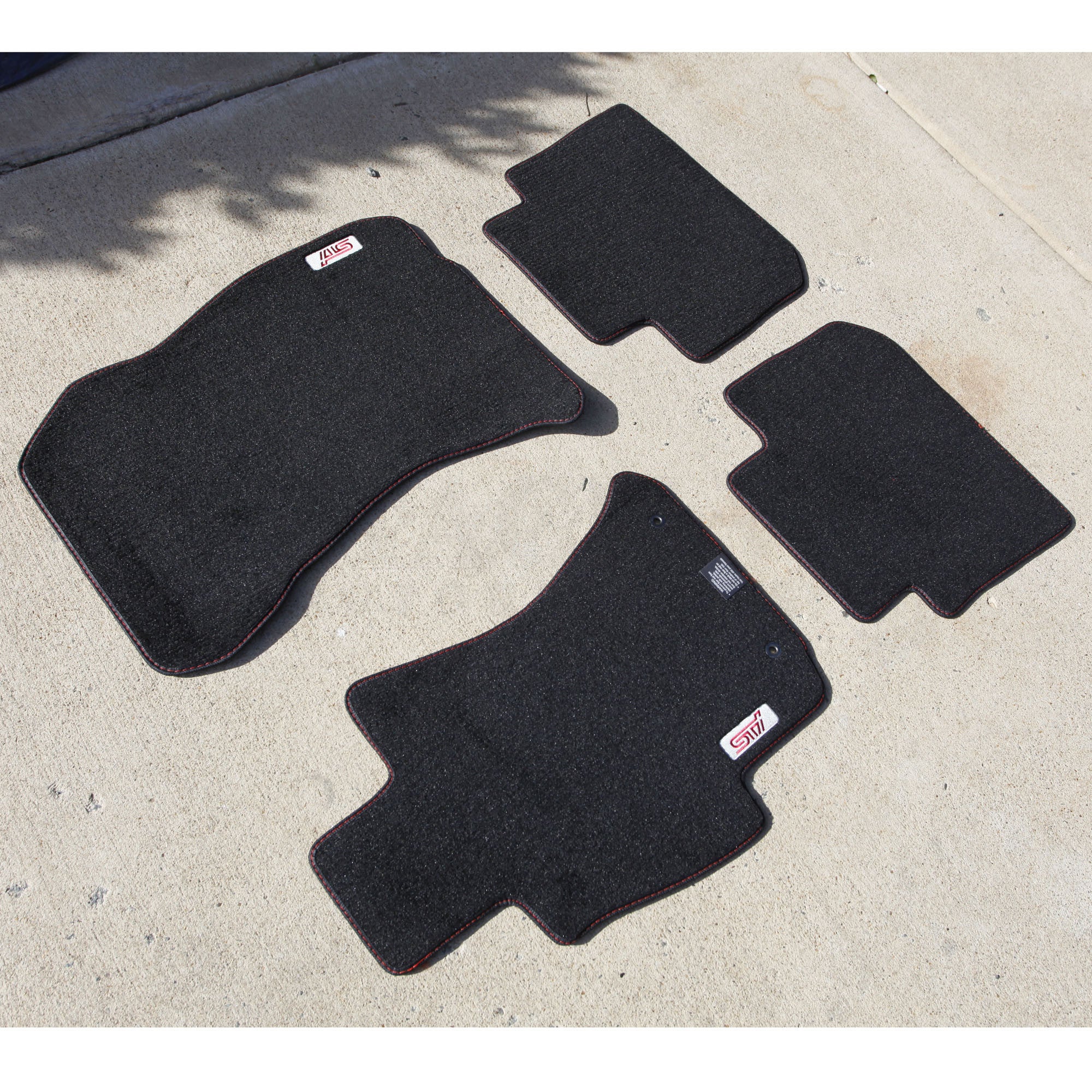 https://www.fastwrx.com/cdn/shop/products/STI_mats_red_trim_5000x.jpg?v=1571438895