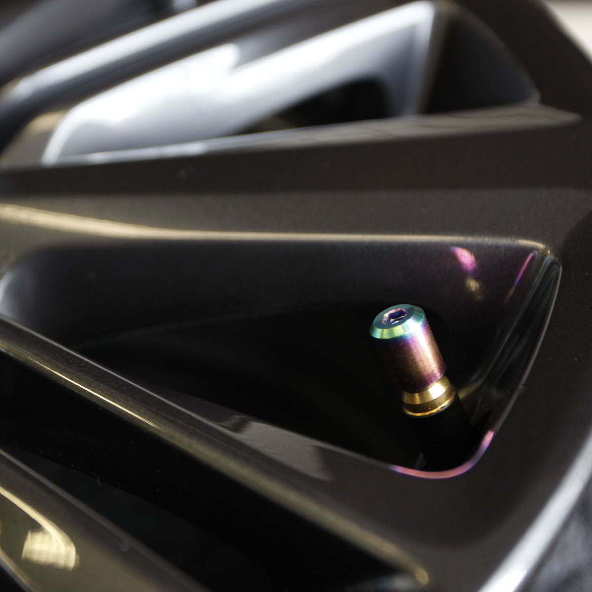 Ti Valve Stem Cap (True Burn) on wheel