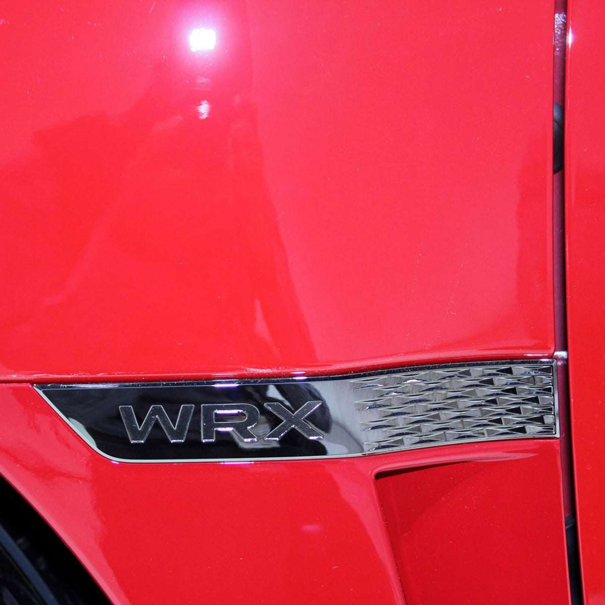 2015+ WRX Fender Garnish Chrome on Red Car